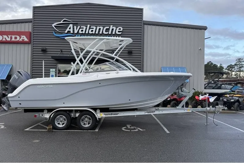 Slide: The Image of 2026 Sea Fox 228 Traveler boat on trailer outside dealership. - 3