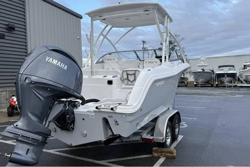 Slide: The Image of 2026 Sea Fox 228 Traveler boat with Yamaha engine on trailer in parking lot. - 5