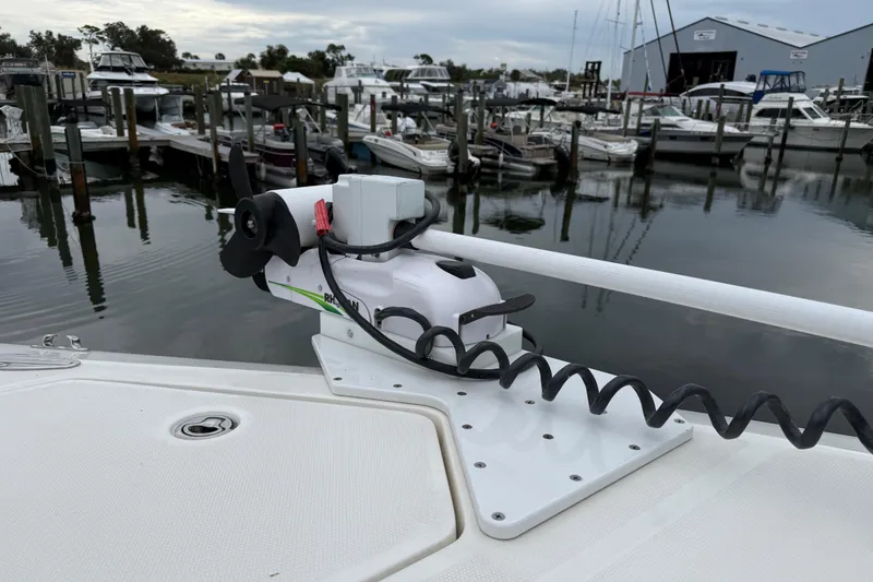 Slide: The Image of 2022 SeaVee 270Z boat with trolling motor docked at marina. - 11