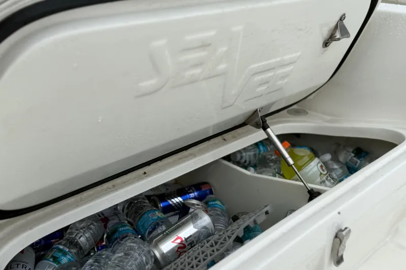 Slide: The Image of Open cooler on 2022 SeaVee 270Z boat filled with drinks and water bottles. - 19