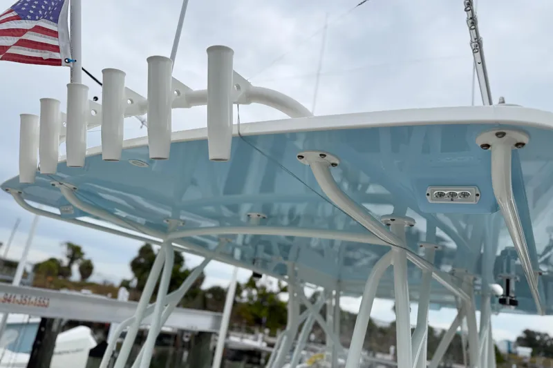 Slide: The Image of 2022 SeaVee 270Z boat with rod holders and American flag on deck. - 21