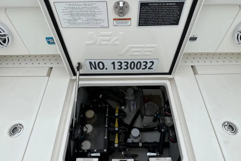 Slide: The Image of 2022 SeaVee 270Z boat compartment with visible serial number and equipment. - 23
