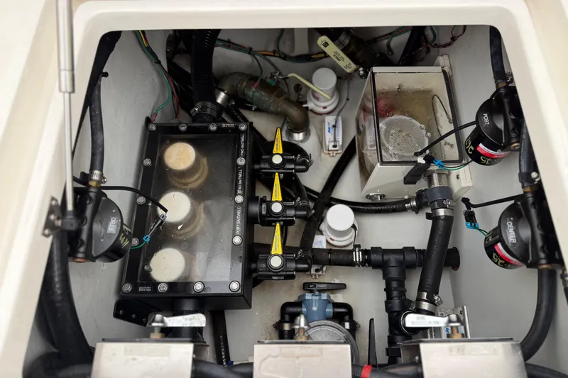 Slide: The Image of 2022 SeaVee 270Z boat engine compartment with visible wiring and components. - 24