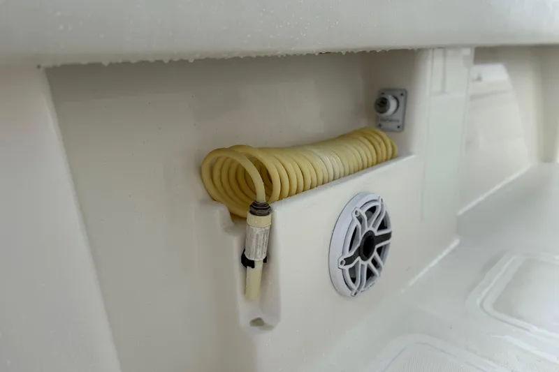 Slide: The Image of 2022 SeaVee 270Z boat detail with coiled hose and speaker. - 27