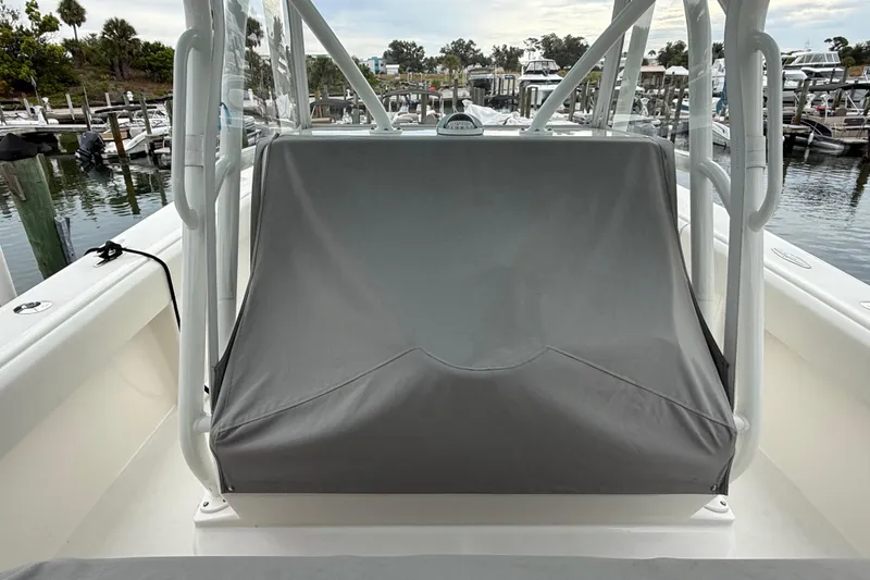 Slide: The Image of 2022 SeaVee 270Z boat with covered console, docked at marina. - 3