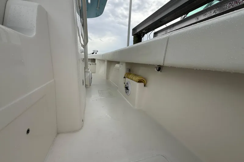 Slide: The Image of 2022 SeaVee 270Z boat interior with clean white deck and speaker detail. - 30