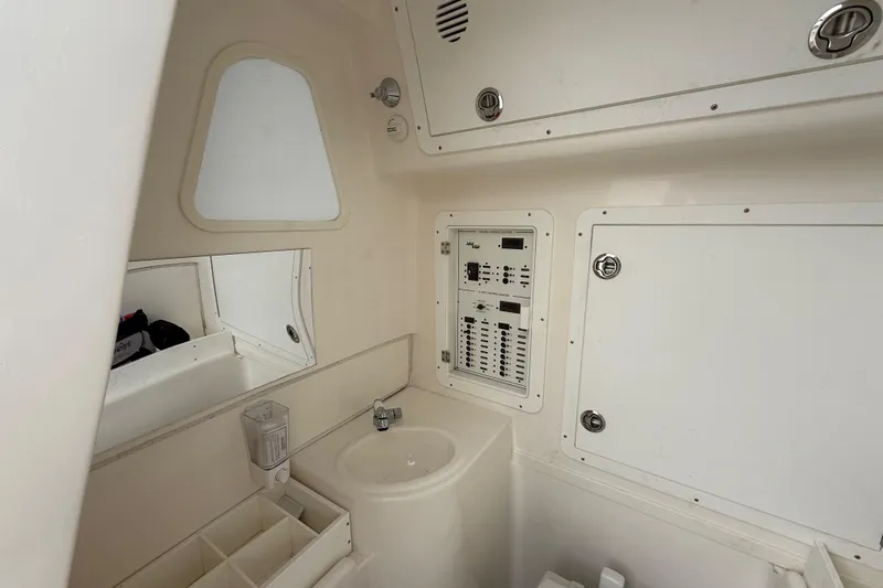 Slide: The Image of 2022 SeaVee 270Z boat interior with control panel and sink. - 32