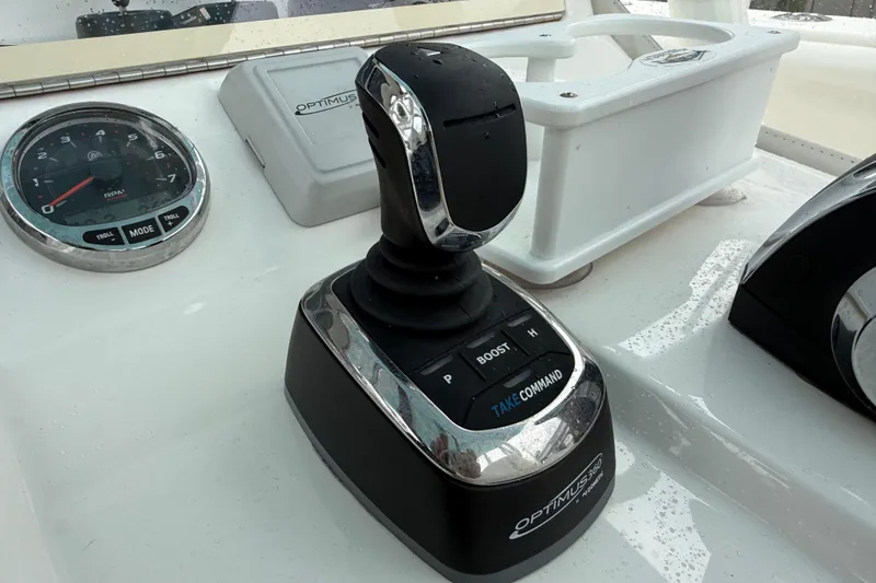 Slide: The Image of Optimus 360 joystick control on 2022 SeaVee 270Z boat dashboard. - 36