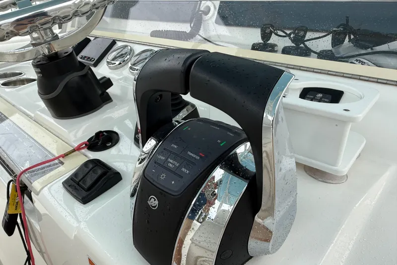 Slide: The Image of 2022 SeaVee 270Z boat helm with modern controls and steering wheel. - 38