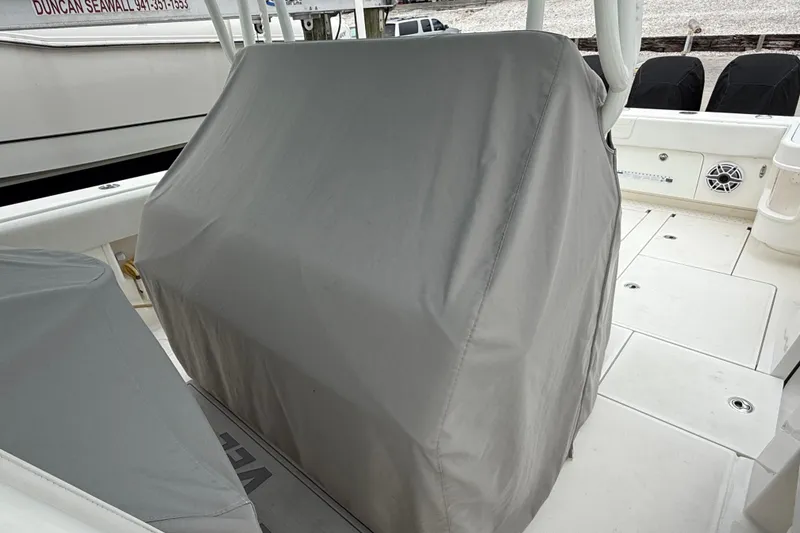 Slide: The Image of 2022 SeaVee 270Z boat interior with covered console and seating area. - 4