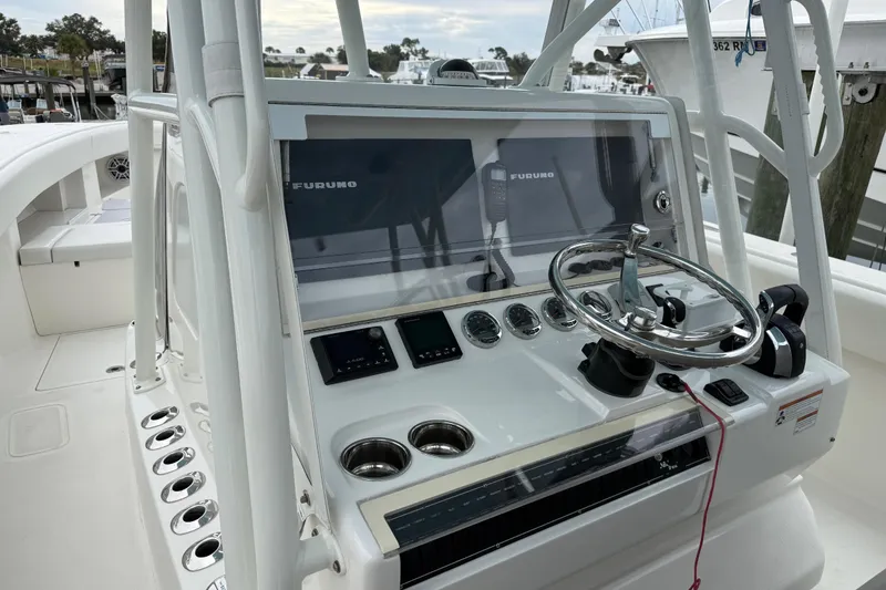 Slide: The Image of 2022 SeaVee 270Z boat console with steering wheel and navigation equipment. - 5