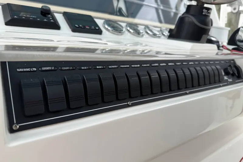 Slide: The Image of Control panel of a 2022 SeaVee 270Z boat with labeled switches. - 6