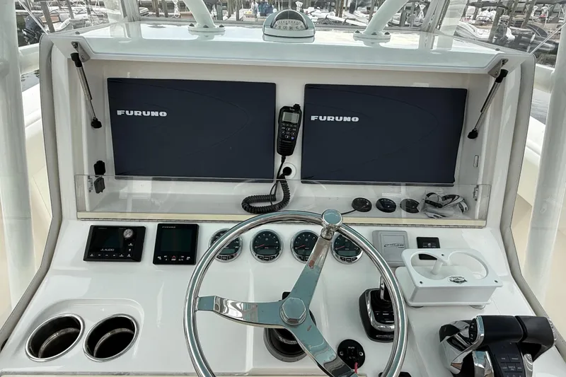 Slide: The Image of 2022 SeaVee 270Z helm with Furuno displays and modern navigation controls. - 7