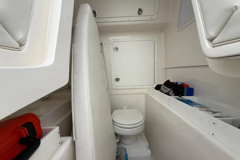 Slide: The Image of 2022 SeaVee 270Z boat interior with toilet and storage compartments. - 9