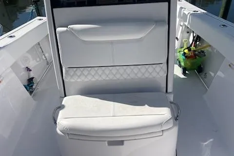 Slide: The Image of 2025 Sportsman Heritage 261 Center Console boat interior with white seating. - 10