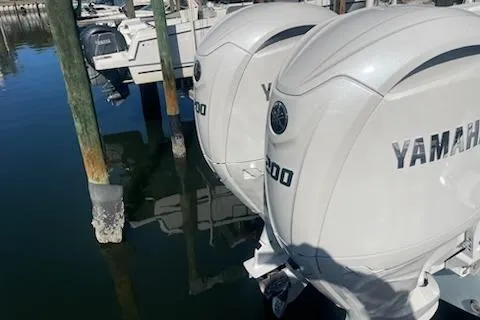 Slide: The Image of 2025 Sportsman Heritage 261 Center Console with Yamaha engines docked at marina. - 3