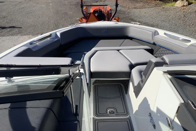 Slide: The Image of 2022 Cobalt R6 Surf boat interior with sleek seating and modern design. - 4