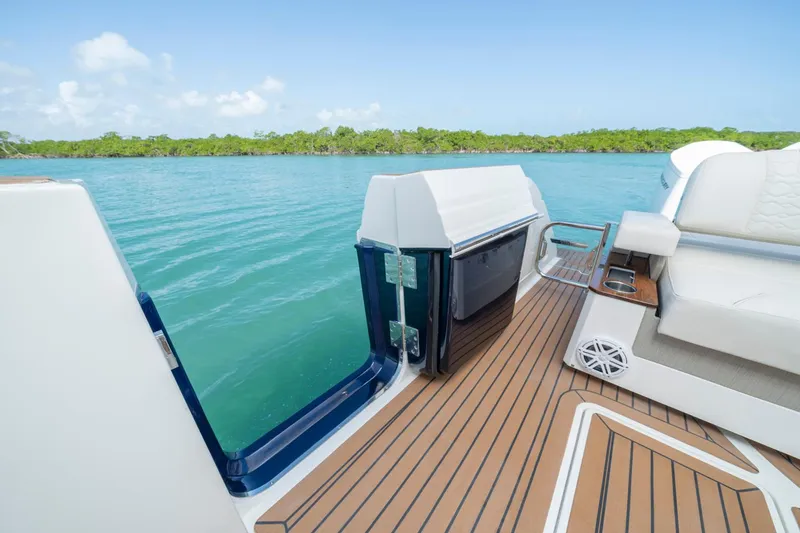 Slide: The Image of Manufacturer Provided Image: 2024 Tiara Yachts 48 LS deck with luxurious seating and scenic water view. - 7