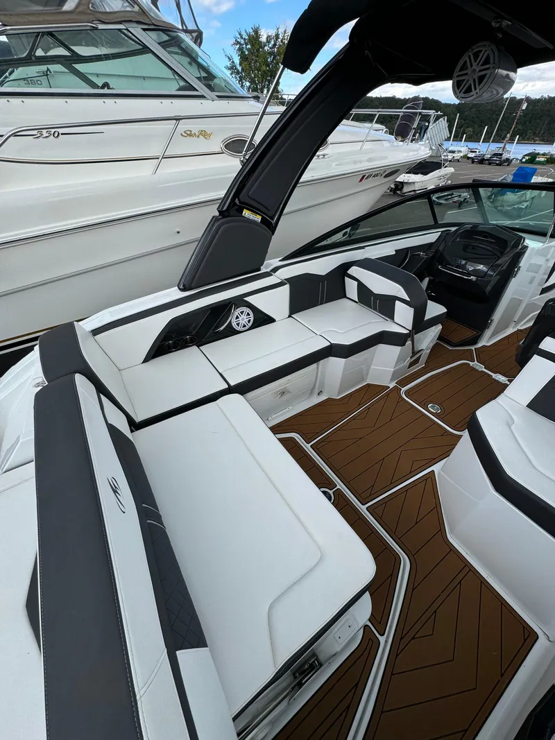 Slide: The Image of 2022 Monterey 258 Super Sport boat interior with sleek seating and modern design. - 12