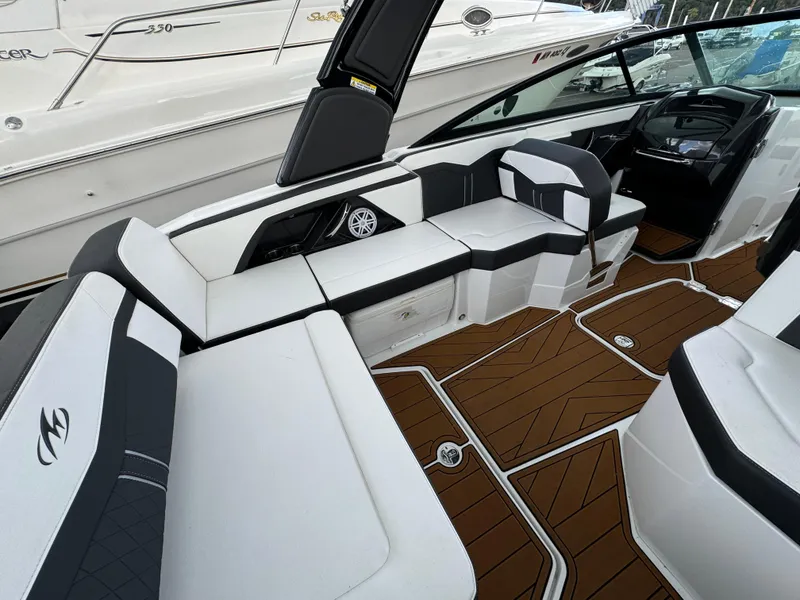Slide: The Image of 2022 Monterey 258 Super Sport boat interior with sleek seating and modern design. - 13