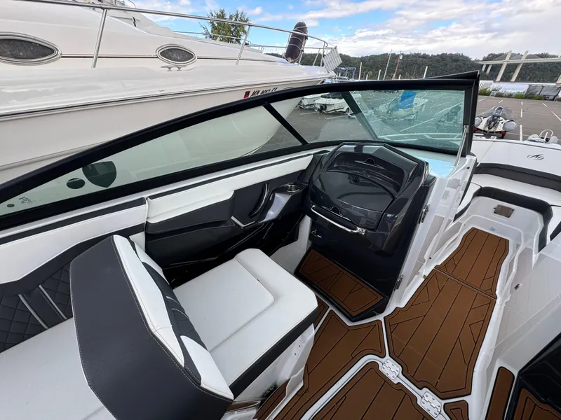 Slide: The Image of 2022 Monterey 258 Super Sport boat interior with sleek design and modern dashboard. - 16