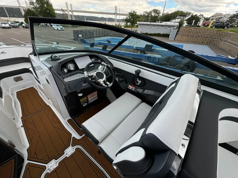 Slide: The Image of 2022 Monterey 258 Super Sport boat interior with sleek dashboard and comfortable seating. - 21