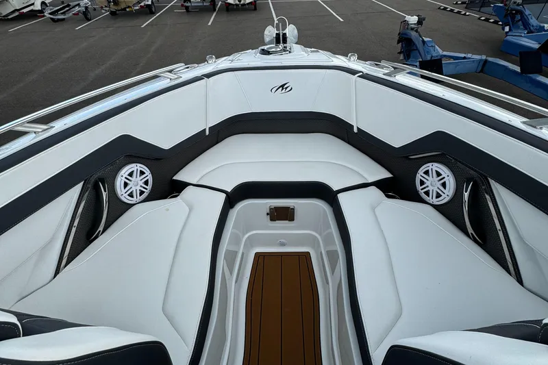 Slide: The Image of 2022 Monterey 258 Super Sport boat interior with white seating and speakers. - 30