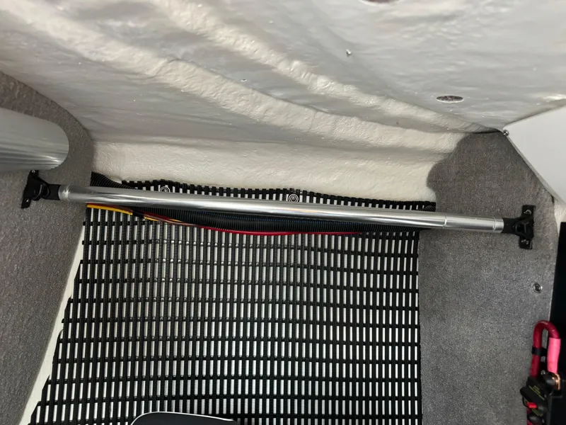 Slide: The Image of Interior view of a 2022 Monterey 258 Super Sport boat compartment with wiring and support bar. - 42
