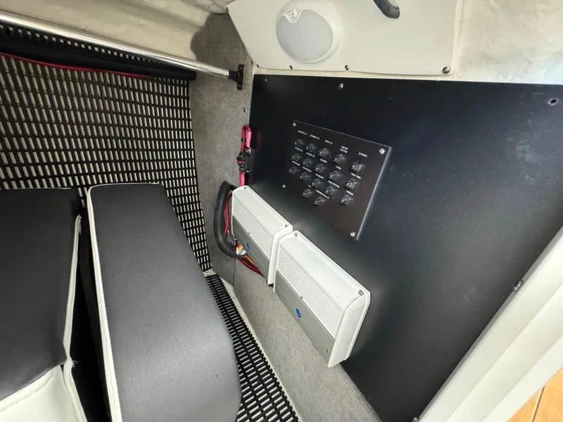 Slide: The Image of Interior of 2022 Monterey 258 Super Sport boat showing control panel and seating area. - 43