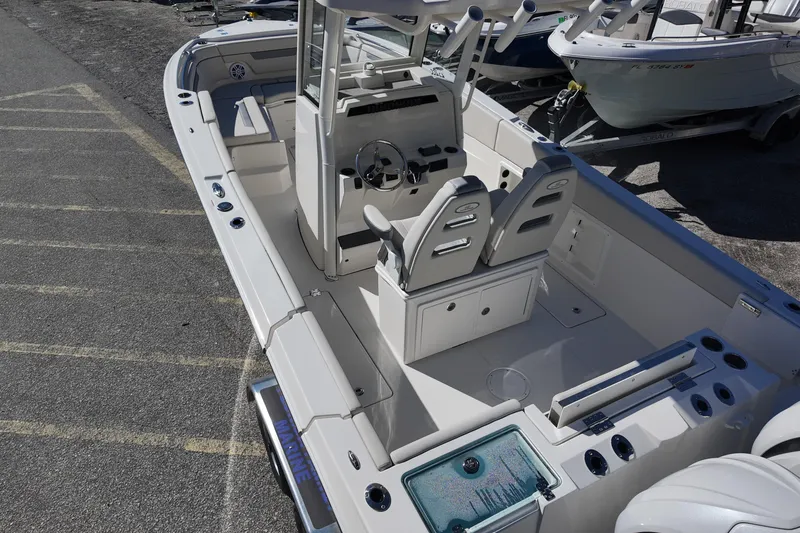 Slide: The Image of 2026 Sailfish 252 CC boat interior with dual seats and steering console. - 15