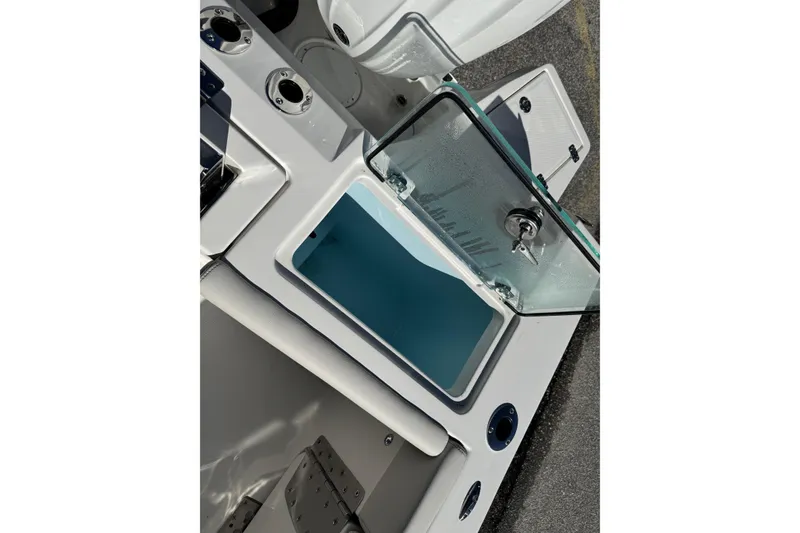 Slide: The Image of 2026 Sailfish 252 CC boat on trailer, featuring sleek blue hull design. - 25