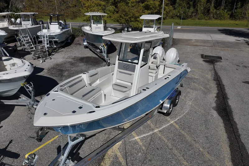 Slide: The Image of 2026 Sailfish 252 CC boat on trailer in outdoor showroom. - 5