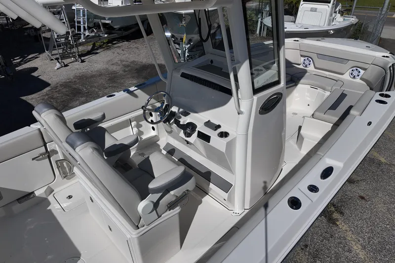 Slide: The Image of 2026 Sailfish 252 CC boat interior with helm and seating area. - 8