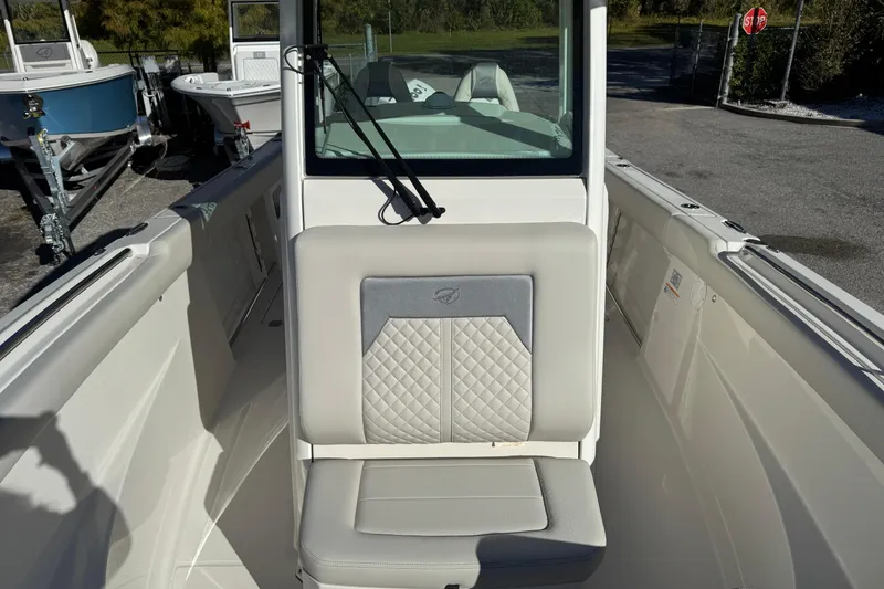 Slide: The Image of 2026 Sailfish 272 SE CC boat interior with cushioned seating and sleek design. - 10