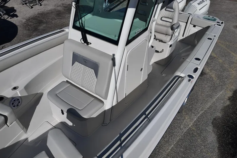 Slide: The Image of 2026 Sailfish 272 SE CC boat in a parking lot, front view. - 11