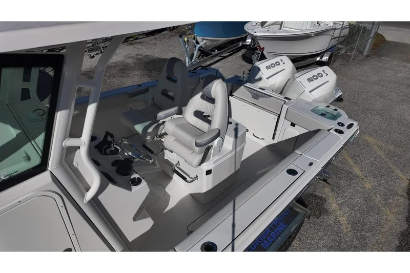 Slide: The Image of 2026 Sailfish 272 SE CC boat interior with seating and console, showcasing modern design. - 13