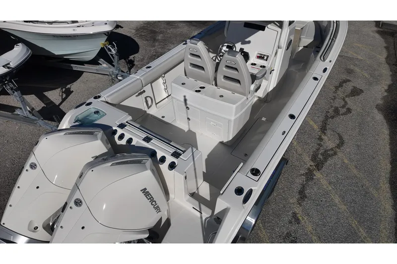 Slide: The Image of 2026 Sailfish 272 SE CC boat on trailer in outdoor lot. - 6