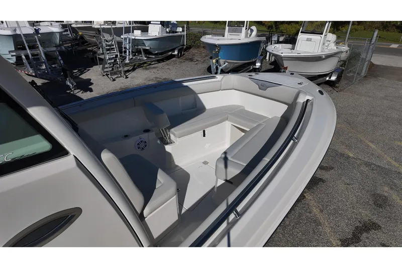 Slide: The Image of 2026 Sailfish 272 SE CC boat with dual Mercury engines, spacious deck, and modern seating. - 8