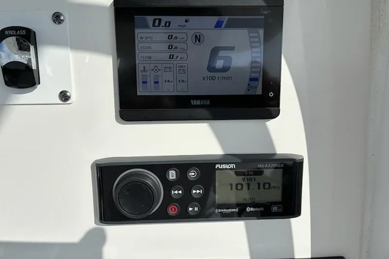 Slide: The Image of Edgewater 230CC 2022 dashboard with Yamaha display and Fusion audio system. - 5