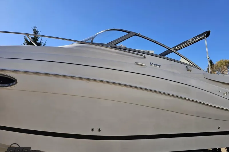 Slide: The Image of 2008 Four Winns V258 boat against clear blue sky. - 15