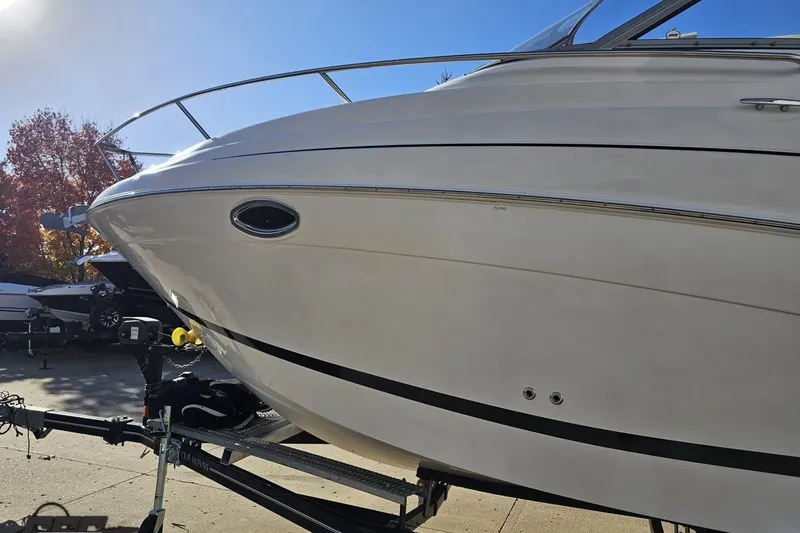 Slide: The Image of 2008 Four Winns V258 boat on trailer, side view, sunny day. - 17