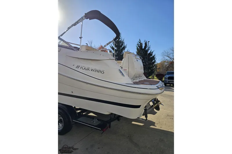 Slide: The Image of 2008 Four Winns V258 boat on trailer, rear view, sunny day. - 19