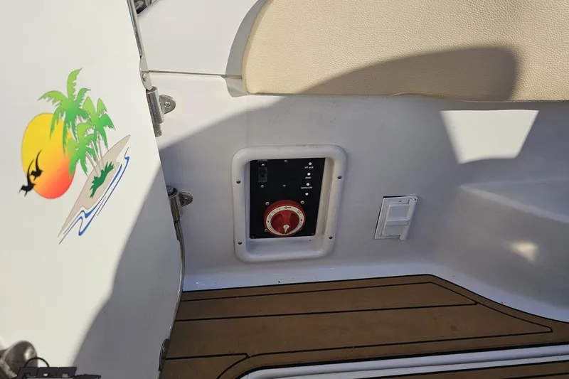 Slide: The Image of 2008 Four Winns V258 boat interior with control panel and tropical island decal. - 30