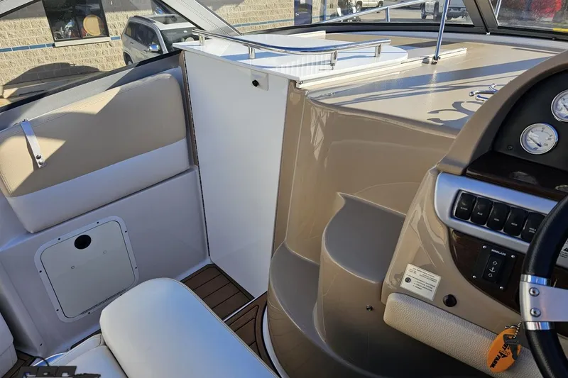 Slide: The Image of 2008 Four Winns V258 boat interior with dashboard and seating area. - 49