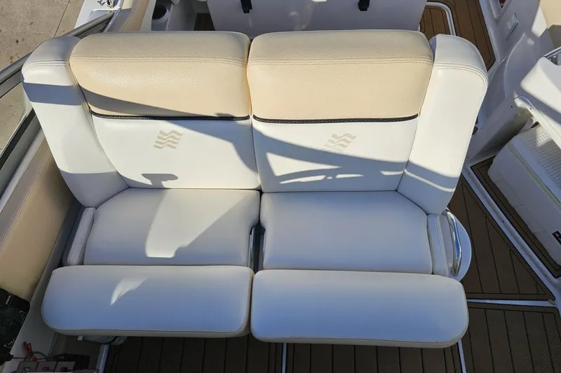 Slide: The Image of 2008 Four Winns V258 boat seating with beige and white upholstery. - 56