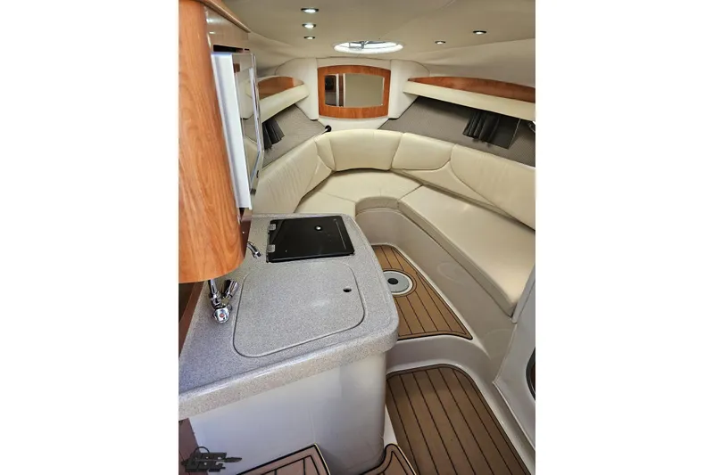Slide: The Image of 2008 Four Winns V258 cabin interior with kitchenette and seating area. - 62