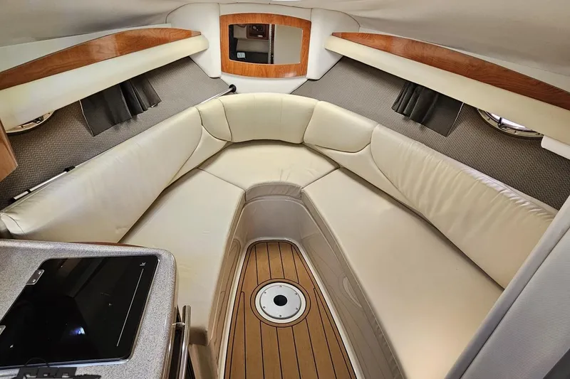Slide: The Image of Luxurious interior of 2008 Four Winns V258 boat with cream leather seating. - 64