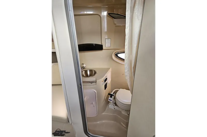 Slide: The Image of 2008 Four Winns V258 boat interior bathroom with sink and toilet. - 74
