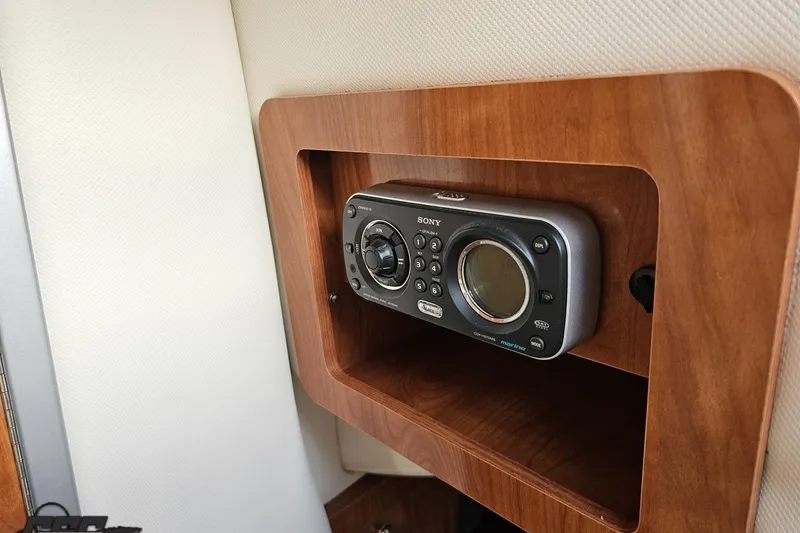 Slide: The Image of Sony marine radio in 2008 Four Winns V258 boat, mounted in wooden panel. - 77