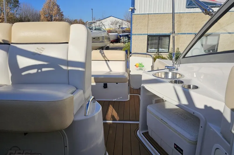Slide: The Image of 2008 Four Winns V258 boat interior with seating and kitchenette area. - 82